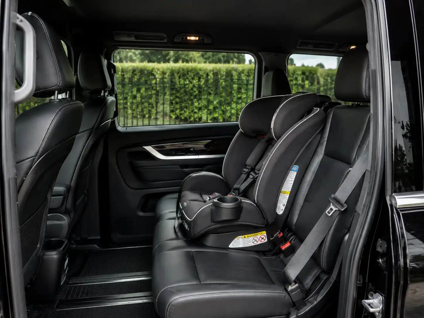 Forward-facing child seat secured in a Melbourne chauffeur vehicle